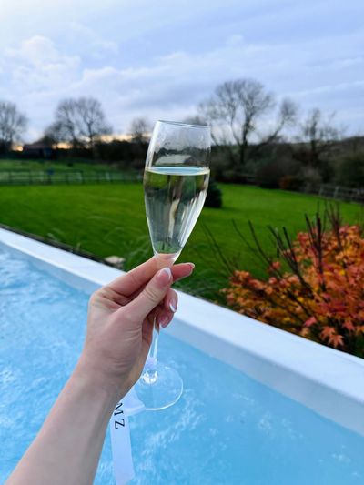 A glass of fizz beside the private hot tub